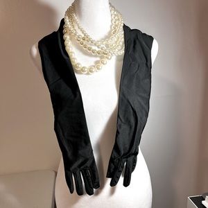 Long over the elbow black gloves and multi strand faux pearl Great for a costume